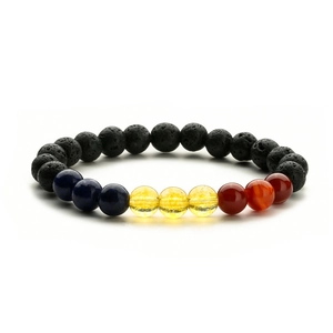 Close-up of tiger eye and lava stone elastic beaded bracelet showing porous texture