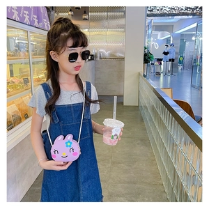 Detail of cute purple bunny shoulder bag with blue floral accent on young girl