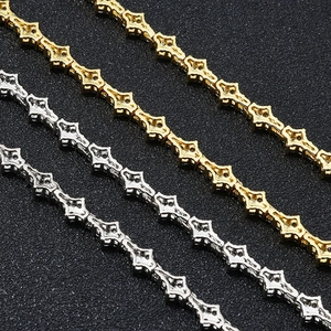 Detailed view of hip hop style zircon paved necklaces and bracelets in gold and silver