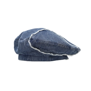 Retro washed denim beret featuring distressed raw-edge stitching and patchwork design