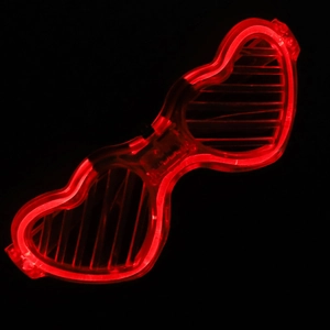 Detail of red LED glowing heart-shaped shutter glasses for vibrant party celebration night