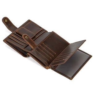 Detail of genuine leather wallet interior featuring card slots and a snap coin pocket