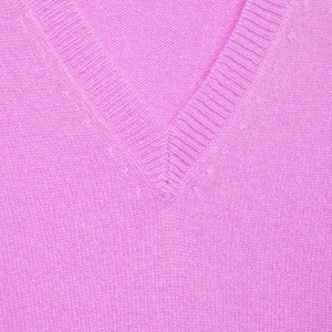 Soft pink V-neck knitted sweater for women with refined ribbed neckline and cozy fabric