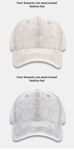 Detail showing two washed denim baseball caps with vintage distressed texture and stitching