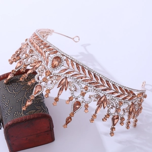 Detail of luxury baroque bridal crown with golden leaves and amber crystals