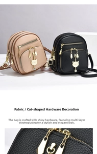 Detail of high-quality gold cat charm with rhinestones on a mini backpack purse