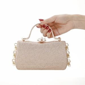 Elegant gold glitter evening clutch bag with pearl and metal accents for women's parties