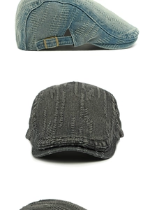 Detail of washed denim flat cap showing quilted wave patterns and metal side buckles