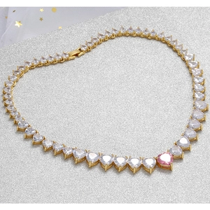 Pink heart zircon necklace with 18K gold plating on shimmering silver background