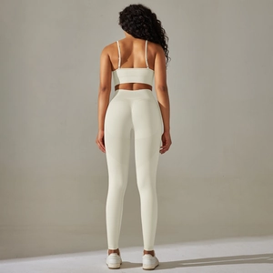 Close-up of seamless ribbed sports set showing crossover back straps and high waist leggings