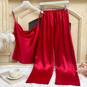 Elegant red satin pajamas set featuring a V-neck camisole and wide-leg trousers