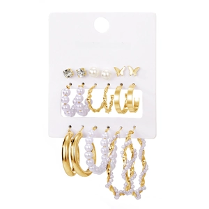 9-piece set of butterfly and pearl gold hoop earrings on a fashion jewelry display card