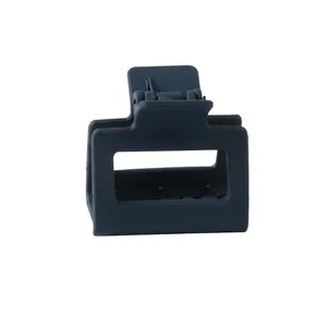 Detailed close-up of a matte dark grey square hair claw clip with a strong metal spring