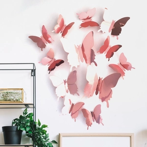 Detailed view of 3D rose gold mirror butterfly wall stickers on white wall home decor
