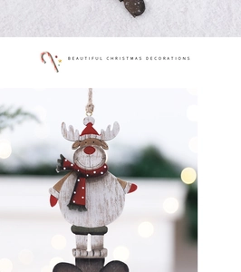 Close-up of a white wooden reindeer ornament with a red scarf and hat for Christmas decor