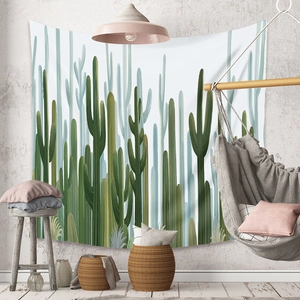 Close-up of bohemian cactus wall tapestry showing hand-painted Nordic style in a cozy room