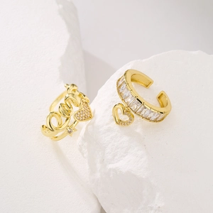 Detail of gold-plated love heart ear cuff set with sparkling cubic zirconia accents