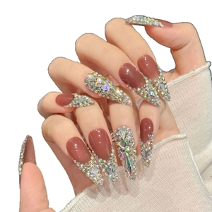 Pink French almond press-on nails with full AB crystal rhinestones and diamond accents