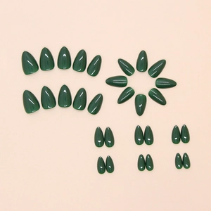 Deep forest green glossy almond press-on nails set displayed on a neutral background