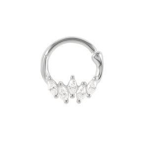 Macro detail of silver cartilage hoop with marquise-cut zircons on a white background
