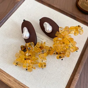 Ethnic wood oval drop earrings with baroque pearl and amber resin bead tassels