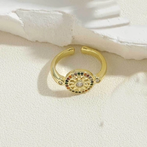 Detailed close-up of a gold sunflower ring featuring colorful zircon stones and star motif