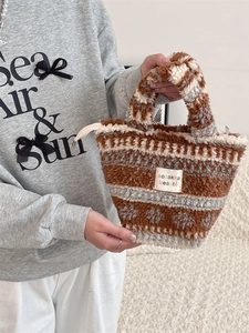 Winter plush handbag with wavy faux fur pattern and comfortable handle for women