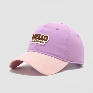 Close-up of kids contrast color baseball cap with HELLO happiness embroidery detail