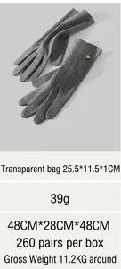 Detail showing grey thermal knit gloves with metal button, weighing 39g for winter