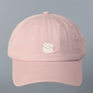 Detailed view of pink cotton baseball cap with white 3D embroidered S logo on the front