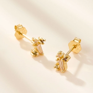 Macro shot of S925 sterling silver geometric earrings with champagne zircon and 18K gold plating