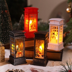 Christmas telephone booth lantern with Santa and snowman illustrations, festive desk decor
