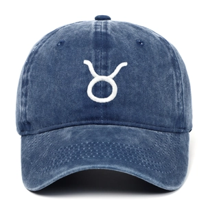 Detailed embroidery of Taurus zodiac sign on navy washed cotton baseball cap