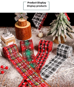 Close-up of rustic plaid ribbons with white snowflake prints for Christmas gifts