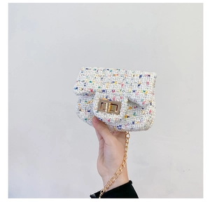 Detail of mini multi-color tweed crossbody bag with golden chain and turn-lock
