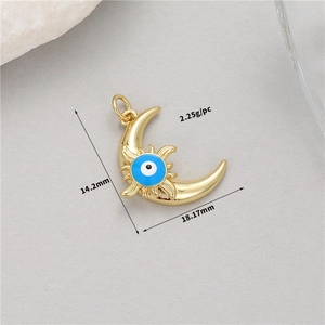Detailed view of a 14K gold moon evil eye pendant with 18.17mm measurements