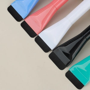 Flat makeup and face mask brushes in five vibrant colors with soft synthetic bristles