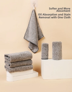 Close-up of thick gray microfiber cleaning cloths showing texture and hanging design