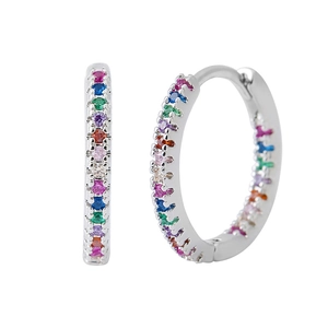 Macro shot of silver huggie hoop earrings featuring multi-color rainbow zircon stones