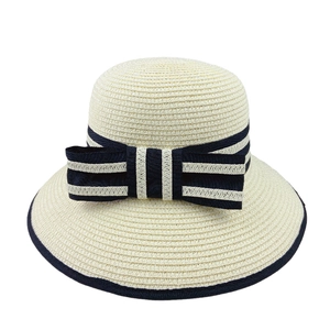 Foldable beige straw sun hat for women with navy striped ribbon bow and wide brim