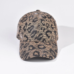 Detailed view of the leopard print baseball cap with textured fabric and classic curved brim