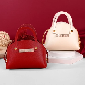 Red and beige shell-shaped PU leather wedding candy boxes with Sweet Love metal buckles