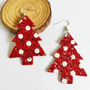 Detail of Christmas tree teardrop earrings with red sequins and white polka dot pattern