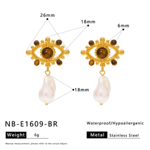 Detail showing dimensions of evil eye earrings with tiger eye stone and baroque pearl