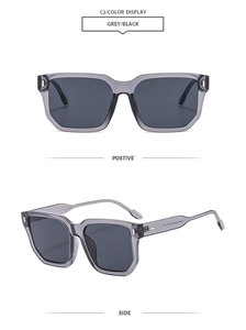 Detail view of retro oversized square sunglasses with grey frames and metal rivet accents