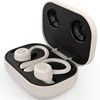 Beige over-ear TWS sports wireless earbuds inside an open charging case on a flat surface