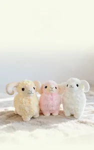 Plush stuffed sheep toys in white pink and yellow with curly lamb fur detail