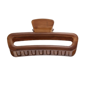 Detail of large brown tortoise shell acrylic hair claw clip with hollow rectangle design