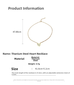 Detail view of gold titanium steel heart necklace with pearl inlay and chain dimensions