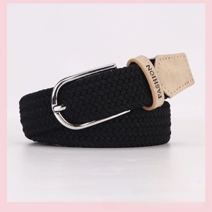 Detail showing black braided elastic belt with beige leather trim and silver metal buckle